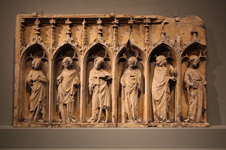Sandstone frieze of religious figures, each in a Goth arch