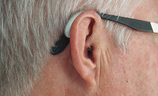 A hearing aid in an ear | Hearing aid near Owosso, Michigan