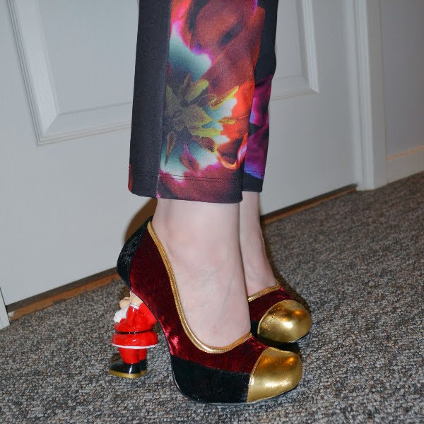 wearing floral trousers and Santa heeled velvet court shoes