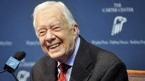 Former US President Jimmy Carter: Even established democracies can fall into the hands of tyrants and tyrants  In an article for the New York Times , the 39th US President Jimmy Carter expressed his fear for his country's democracy, warning that even established democracies can fall into the hands of dictators and military tyrants, and therefore cannot be allowed to happen in the United States.  He referred to the storming of the Capitol on January 6, 2021 by violent mobs led by what he called unscrupulous politicians, and how this attempt almost succeeded in preventing the democratic transfer of power.  And one year after that event, Carter added, the promoters of the election theft lie have taken over one political party and cast doubt on our electoral systems, noting that those forces exercise power and influence through persistent misinformation and continue to turn Americans against each other.  Carter pointed to the Survey Center on American Life report that 35% of Americans - nearly 100 million adults across the political spectrum - agree that "the traditional American way of life is disappearing so quickly that we may have to use force to save it."  The Washington Post recently reported that nearly 40% of Republicans believe violent action against the government is sometimes justified.  Carter added that politicians in his state of Georgia and in other states have exploited the mistrust they have created to enact laws that enable partisan legislatures to interfere in electoral processes, and seek to win by any means, as many Americans are persuaded to think and act similarly, which threatens to collapse the foundations on which the security of country and its democracy.  Carter now fears that what America has struggled so hard to achieve globally, the right to free and fair elections unhindered by authoritarian politicians who only seek to develop their power, is dangerously fragile at home. He believes that in order for American democracy to continue, we must ask our leaders and candidates to uphold the ideals of freedom and adhere to high standards of behavior, through the following steps:  What America has striven to achieve globally, the right to free and fair elections unhindered by authoritarian politicians who only seek to develop their power, is dangerously fragile at home.  First, while citizens can differ on policies, people of all political spectrum must agree on basic constitutional principles and standards of fairness and respect for the rule of law, that citizens be able to participate easily in transparent and secure electoral processes, and that claims of electoral wrongdoing should be brought in good faith to adjudicate in which the courts, with all participants agreeing to accept the results, and that the electoral process be conducted peacefully and free from intimidation and violence.  Second, press for reforms that guarantee security and access to elections and ensure public confidence in the accuracy of results, because false allegations of illegal voting and multiple pointless checks detract from democratic ideals.  Third, the polarization that reshapes identity around politics must be resisted, and we must focus on some basic facts: We are all human, we are all Americans, and we have common hopes for the prosperity of our communities and our country. We must find ways to re-engage across division, respectfully and constructively, through civic dialogues with family, friends, and co-workers, and collectively standing up to the dividing forces.  Fourth: Violence has no place in our politics, and we must act urgently to pass or strengthen laws to reverse the trends of character assassination, intimidation, and the presence of armed militias. We must protect election officials from what threatens their safety. Law enforcement should have the authority to address these issues and engage in a national effort to come to terms with the past and the present.  Finally, the spread of misinformation, especially on social media, must be addressed. And the need to reform these platforms and get used to searching for accurate information. US companies and religious communities should encourage respect for democratic standards, participation in elections, and efforts to counter disinformation.  "Our great nation is now teetering on the brink of a widening abyss," Carter concluded. "Without immediate action, we are in real danger of civil strife and the loss of our precious democracy. Americans must set aside differences and work together before it is too late."