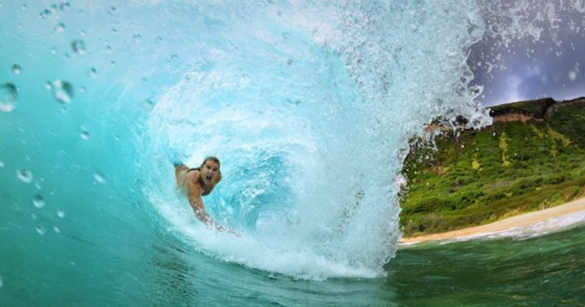 A man playing with waves as bodysurfing