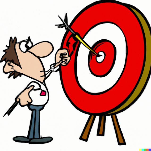 a man stood next to a target on which he has hit the bullseye thanks to setting realistic goals