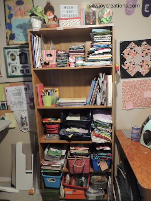 bookshelf in sewing room
