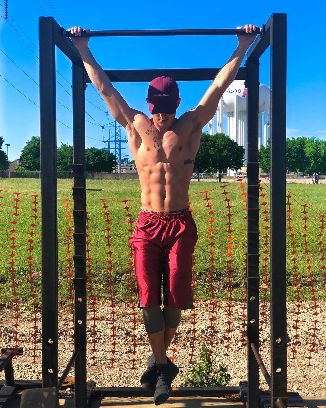 handsome-young-fit-shirtless-guy-working-out-outdoor-gym