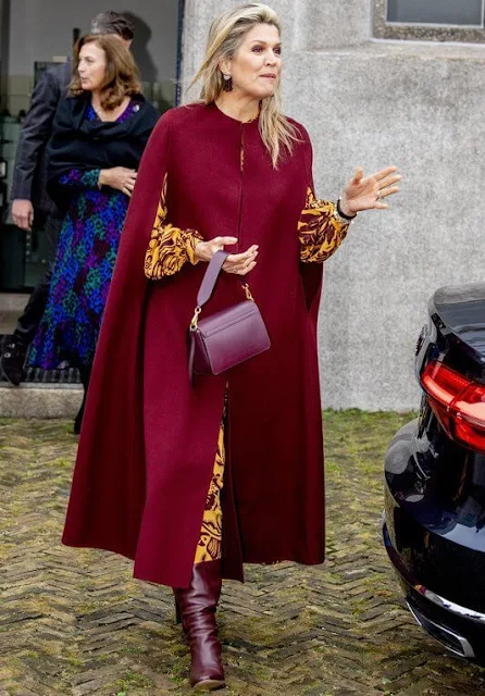 Queen Maxima wore a botanical-print silk maxi dress from Johanna Ortiz, and red wool cape from Natan