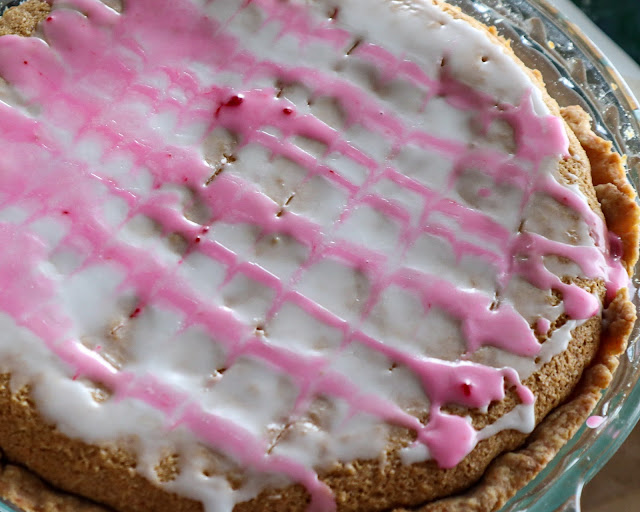 Full bakewell tart in a glass pie dish