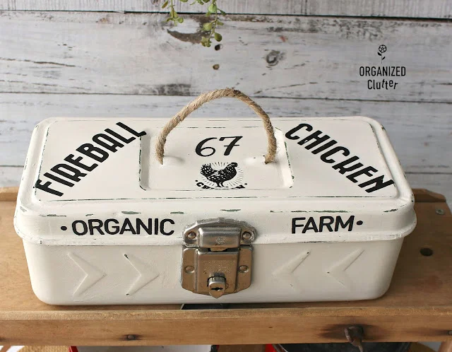 Photo of a farmhouse style toolbox makeover with rub on transfers.