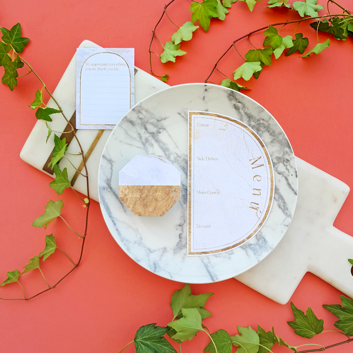 elegant dinner party menu, place, and gratitude cards, marble and golden textures, marble cutting board, ivy branch, green leaves, marbled plate,