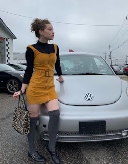 Zoe Margaret Colletti posing for picture with the car