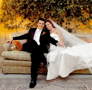 Jennifer Lynn Stone with her husband Fred Savage in their wedding dress