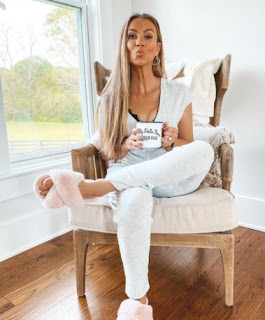 Angela Stacy posing for a picture while sitting in the chair