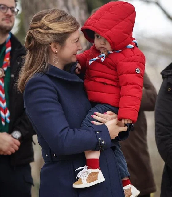 Princess Stephanie wore a blue Gibbsmoore coat by Burberry. Prince Charles wore a red puffer jacket by Petit Bateau