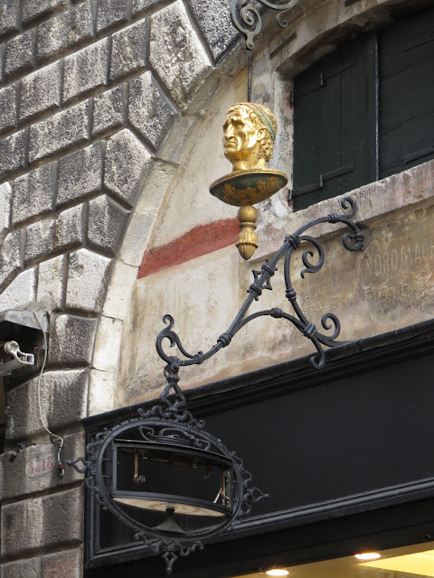 Old sign of the former La Testa d'Oro (The Golden Head) apothecary, Salita Pio X, Venice