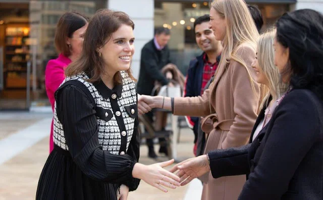 Princess Eugenie wore a black pleated dress with tweed cardigan short jacket from Oscar De La Renta, and black, knee-high boots