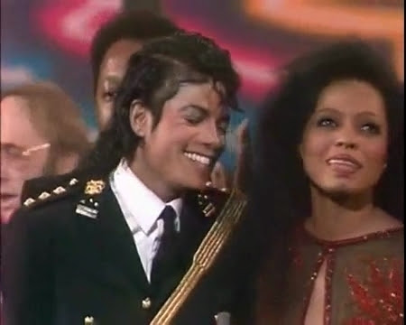 MJ on stage -So happy his > " baby" is there....