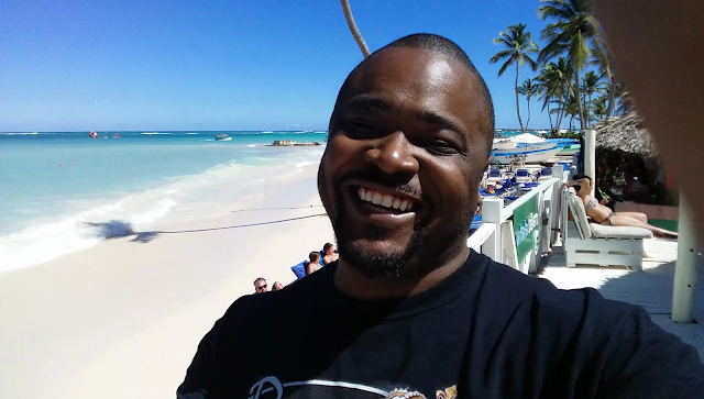 Man standing on the coast by Dominican Republic and Haiti