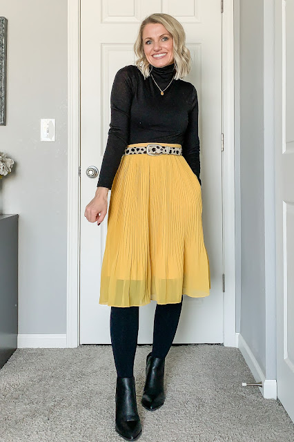 Yellow pleated skirt with turtleneck and tights