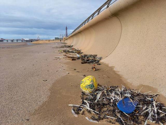 A lost football and an abandoned flip flop on Blackpool promenade.