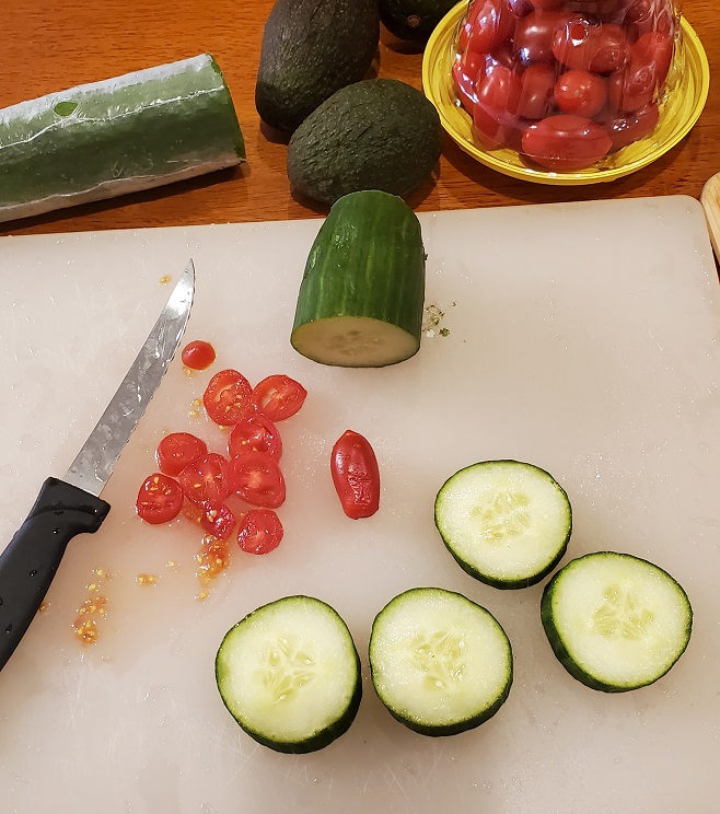 ingredients with cucumber, avocado and tomato for appetizers