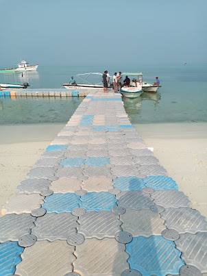 Floating gangway on Agatti beach for boarding/ alighting glass bottom boats and snorkel boats..