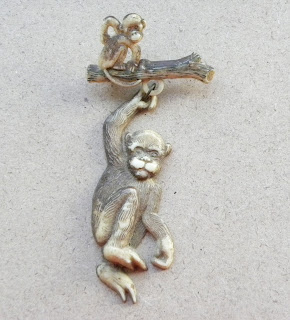 Vintage monkey brooch in celluloid