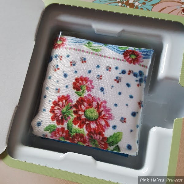 floral satin pouch folded up inside door 13 of beauty advent calendar