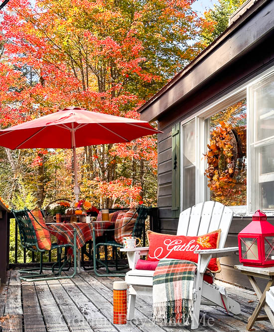 Porch at cabin with fall decor - www.goldenboysandme.com