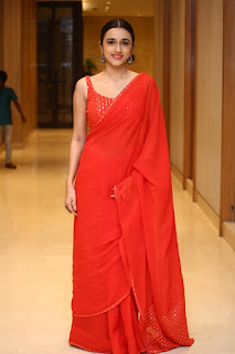 Nuveksha Cute Pic in Red Color Saree