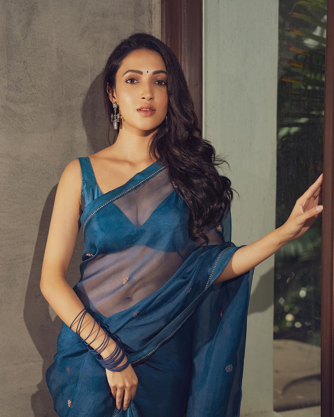 Neha Shetty Sizzles in a Sheer Blue Saree and Cleavage Baring Blouse