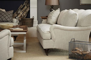 cream sofa in living room with fireplace