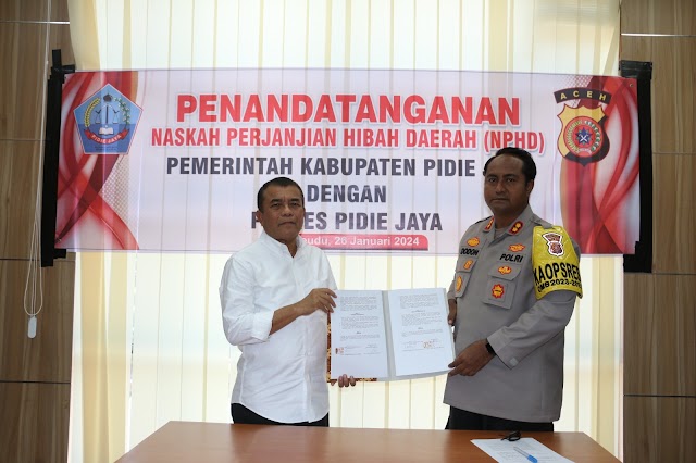 Bupati Pidie Jaya Dengan Kapolres Pidie Jaya Tandatangani NPHD Pemilu 2024