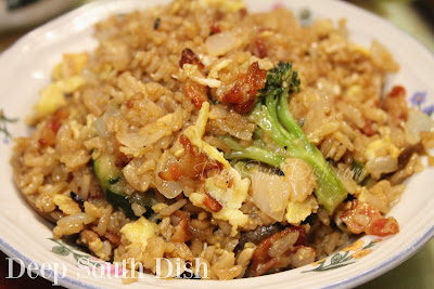 Leftover cooked rice is transformed into a fabulous fried rice dish that starts with bacon, onion and garlic to which leftover or thawed and cooked, frozen mixed vegetables are added along with beaten eggs, all finished with the classic Asian flavors of soy and oyster sauce.