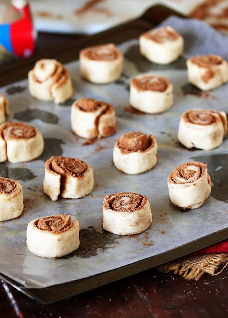 Unbaked Crescent Cinnamon Roll Bites on Baking Sheet Image