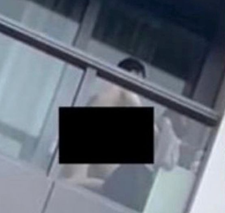 Couple filmed having x on balcony, video leads to woman's arrest