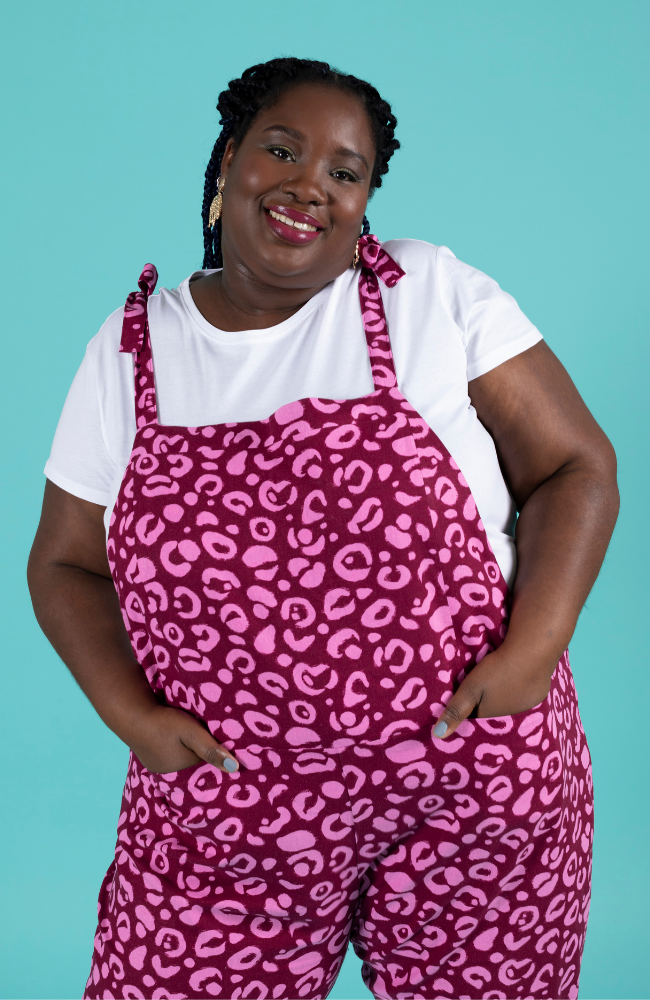 Curvy, plus size model wearing long dungarees or overalls handmade using the Erin sewing pattern