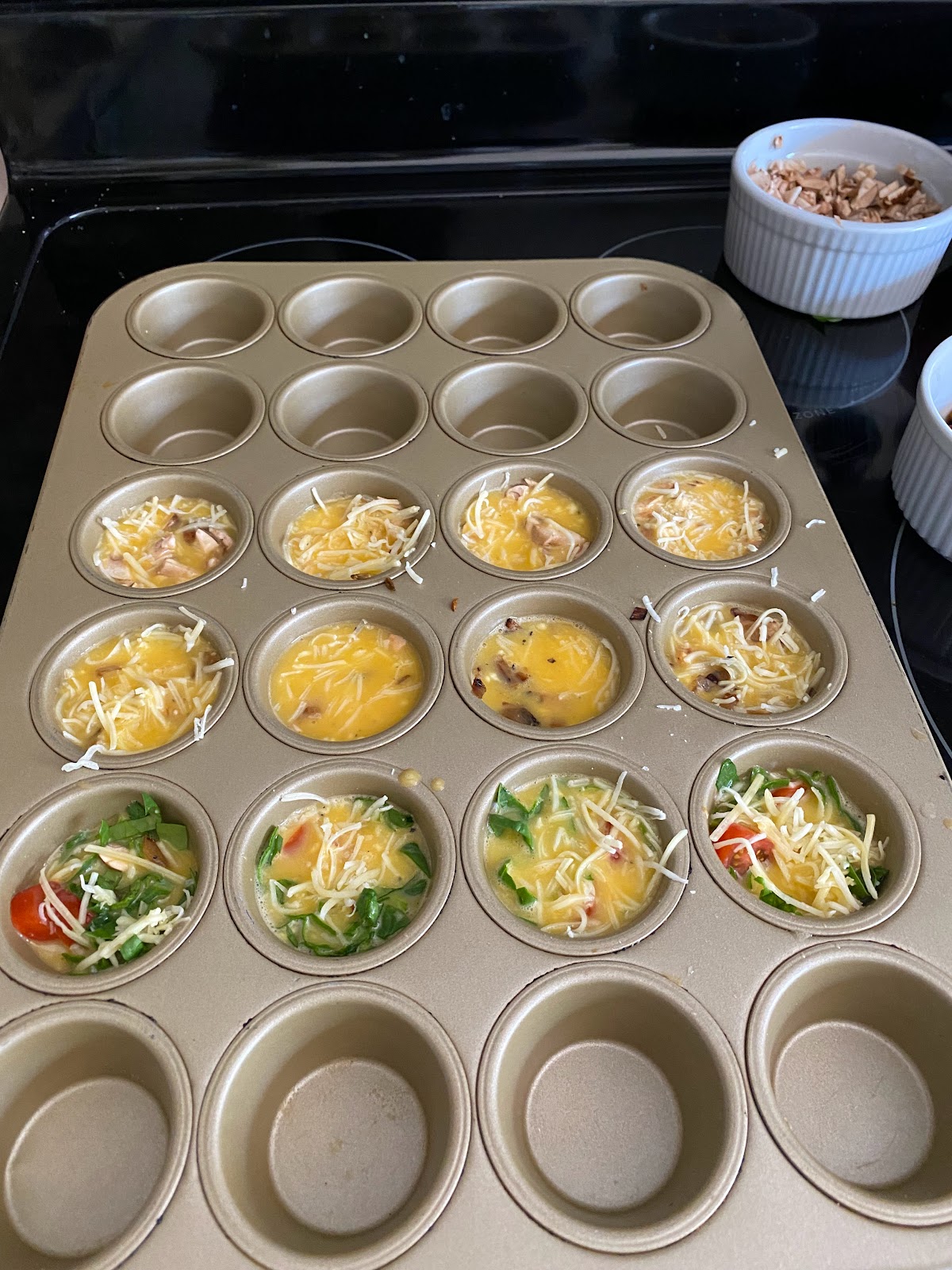 mini muffin tins with egg mixture