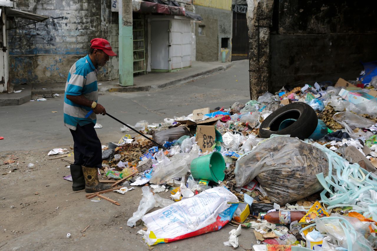 Homeless man searching for food in Caracas, Venezuela