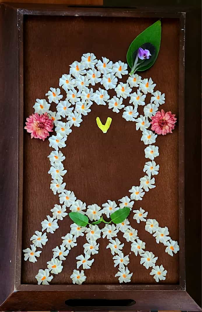 images of Made Lord Krishna with Parijatham flowers - Flower art