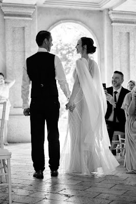 bride and groom holding hands