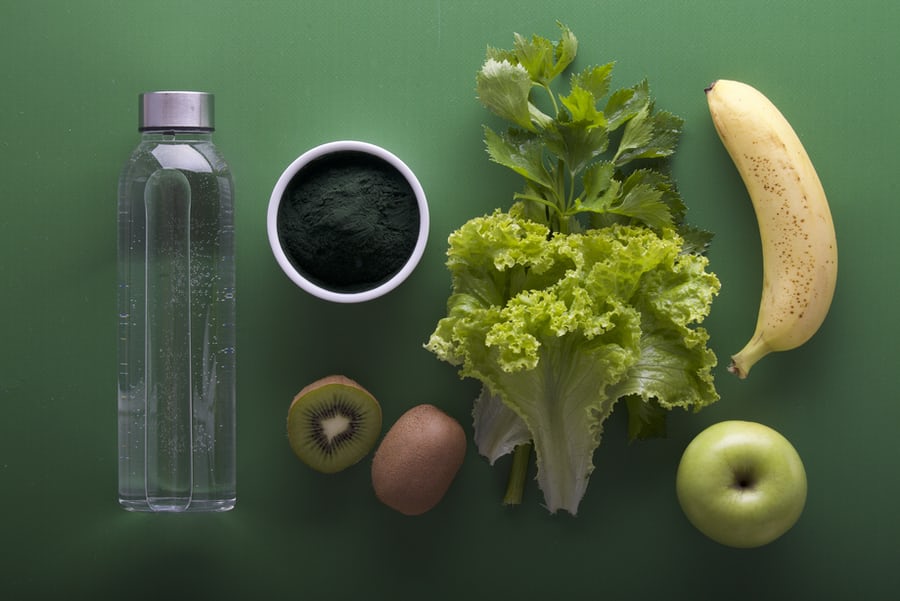 A water bottle,brocolli banana and other vegetables that aid in weight loss