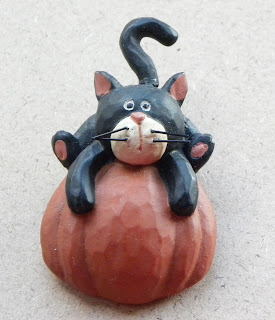 Cat brooch on pumpkin