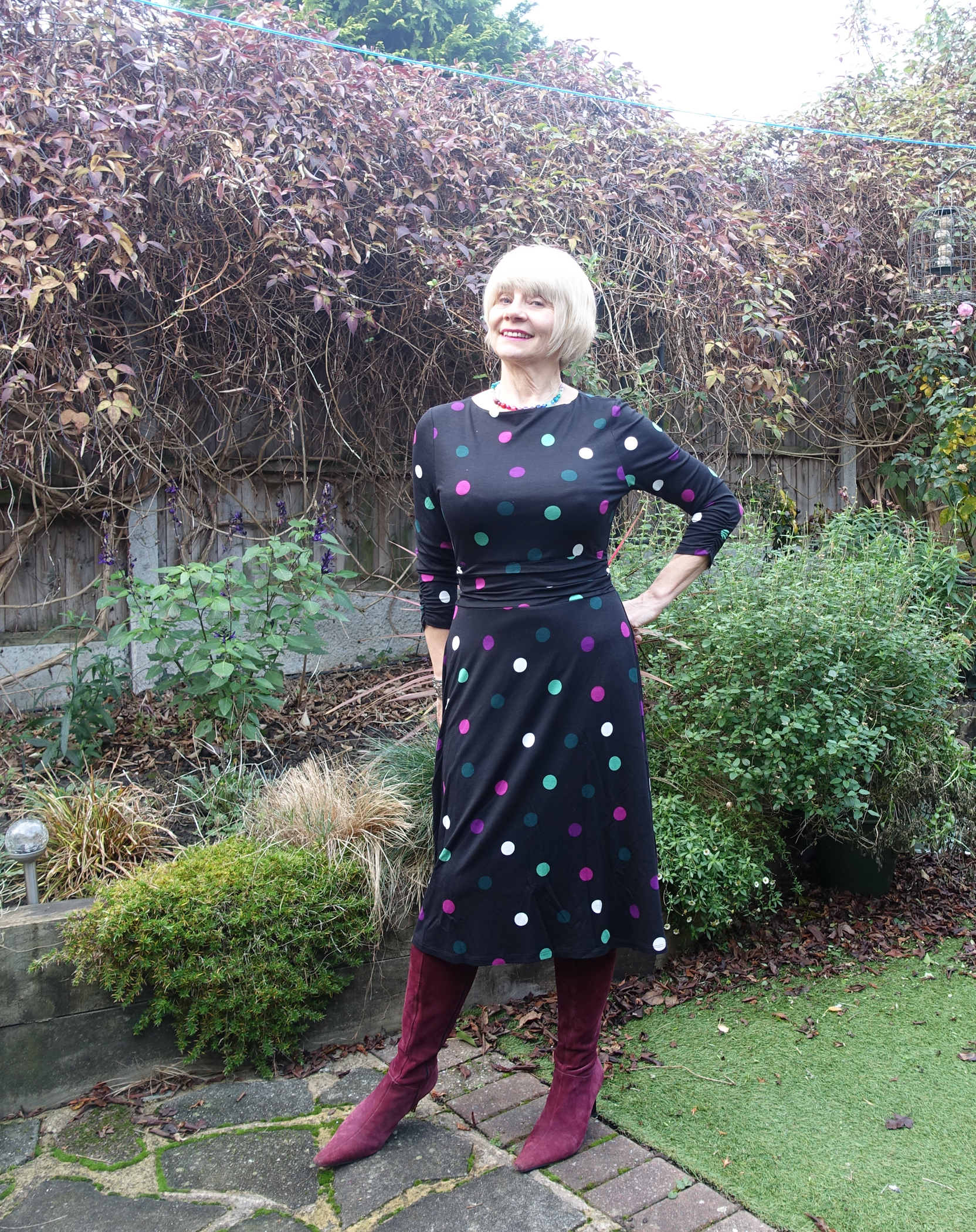 A black dress with colourful winter polka dots worn by over-50 style blogger Gail Hanlon from Is This Mutton