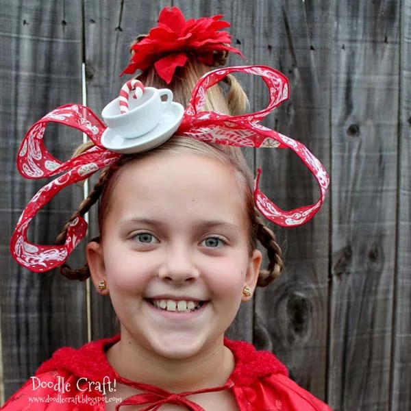 Cindy Lou Who has iconic hair that is perfect for Church Christmas parties, Grinch parties, crazy hair day, and even Halloween. This cute hairdo will get so much attention everywhere it goes!  It's a quick hair style that anyone can do! This is SUCH a popular post, I'm updating it and posting again for all my readers to enjoy! Let me know if you try this hairdo yourself!