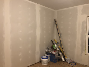 DIY home addition drywall finishing with joint compound sanding