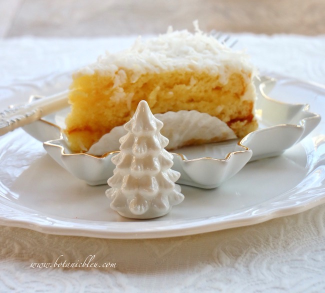 The coconut cake on the Winter tablesetting has a thin jelly icing between two layers