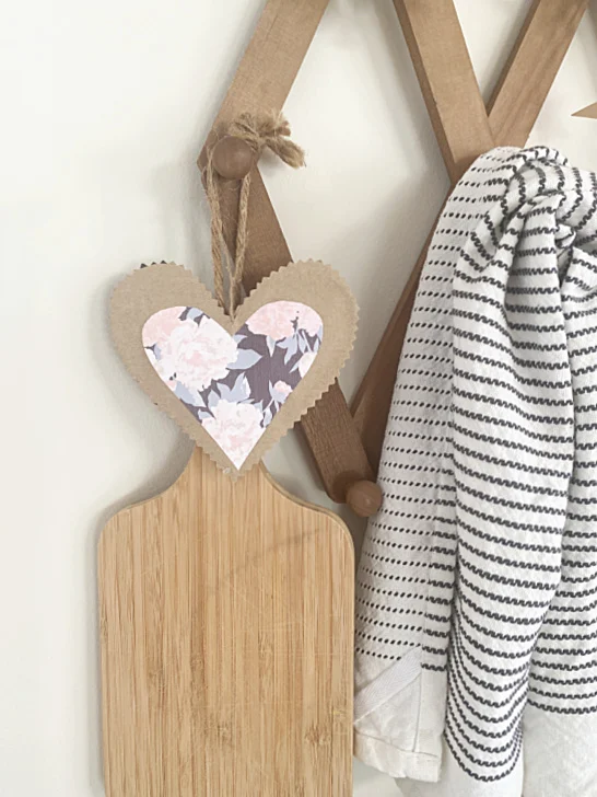 cutting board, towel and paper heart