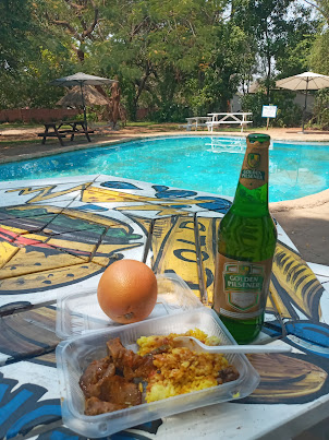 Lunch besides the beautiful poolside of " Shoestrings Backpackers "