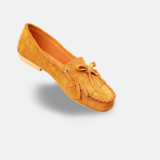 An Unpaired Light Brown Kiltie Loafer Shoe