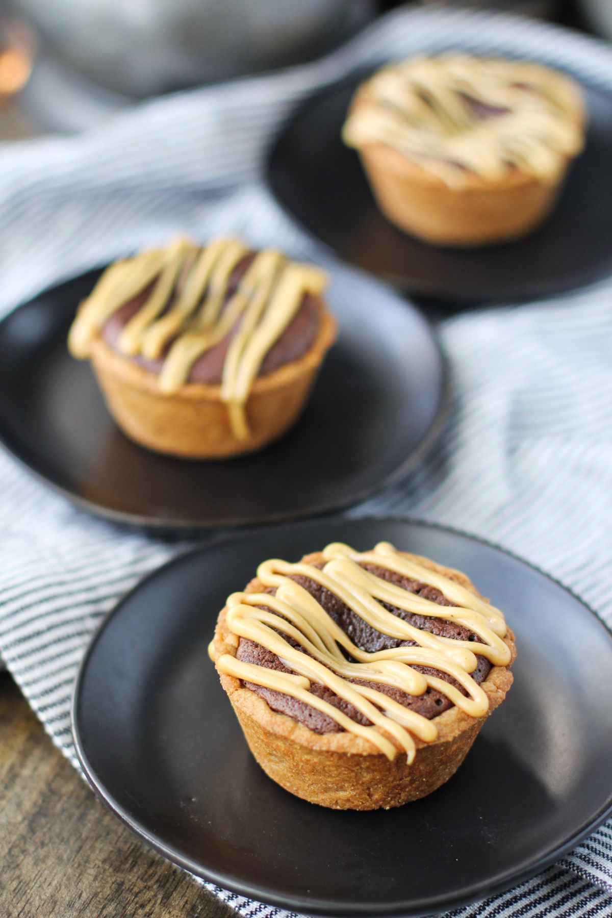 Three plates with peanut butter brownies.