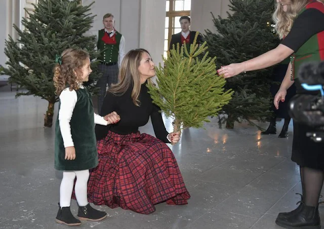 Princess Leonore and Princess Adrienne wore an emerald velvet pinafore dress by Trotters Kids. Chris O'Neill and Prince Nicolas